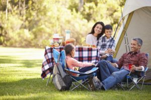 family enjoying camping