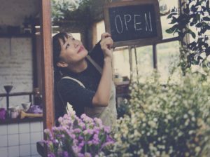 store owner opening her shop