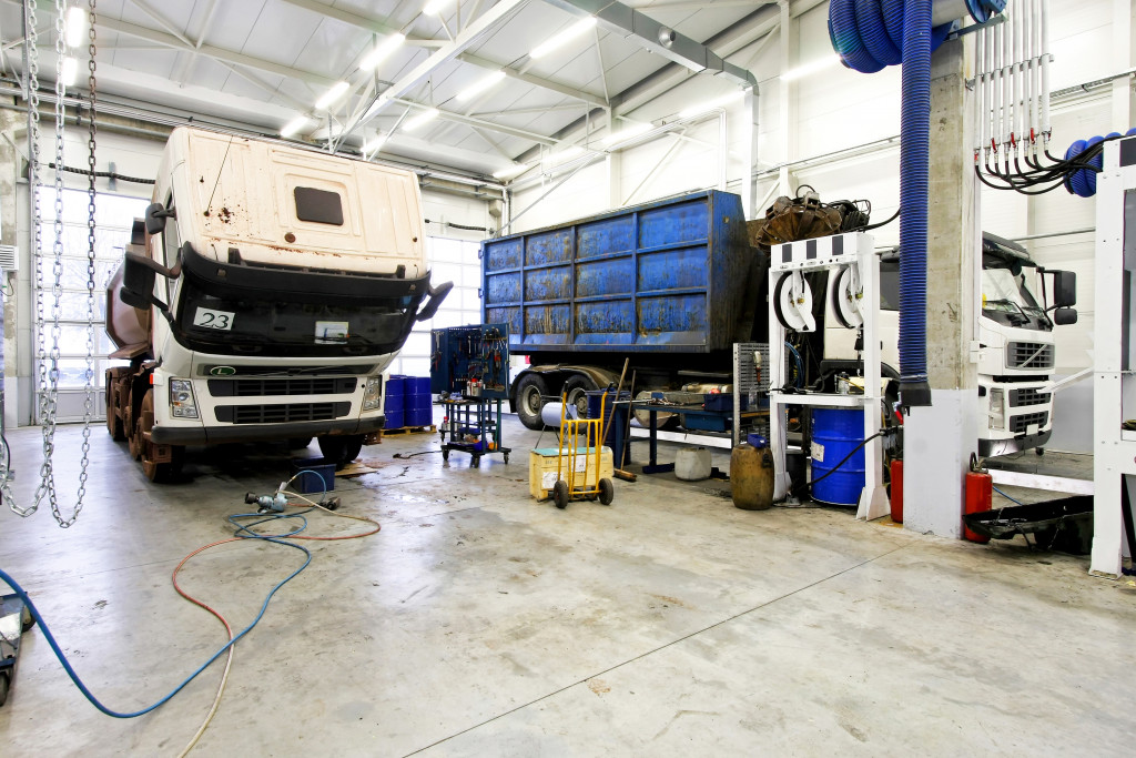 A truck in a garage undergoing maintenance