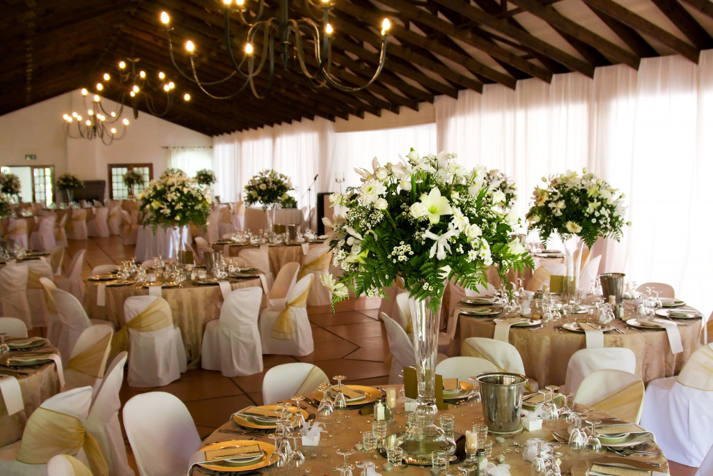 indoor wedding reception with linens and flowers